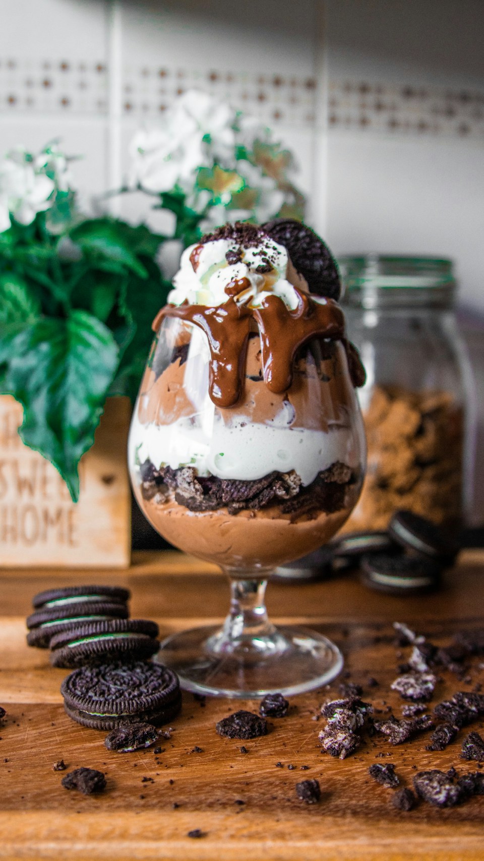 Chocolate and cream ice cream sundae with cookie pieces